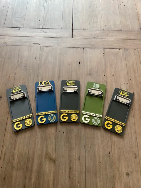 A row of NFC bill holders in different colours during a production run