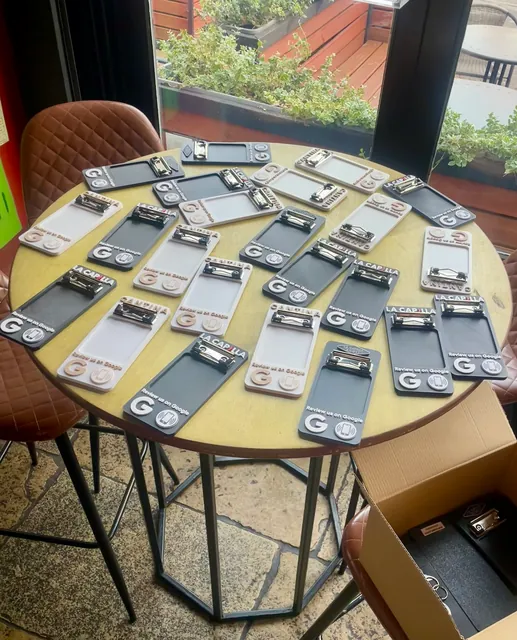 Finished NFC bill holders laid out on a table for quality checks